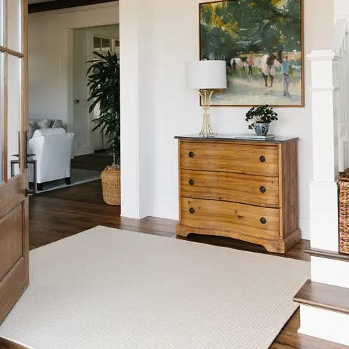 New England Harvest wool rug with serged edge in entry way