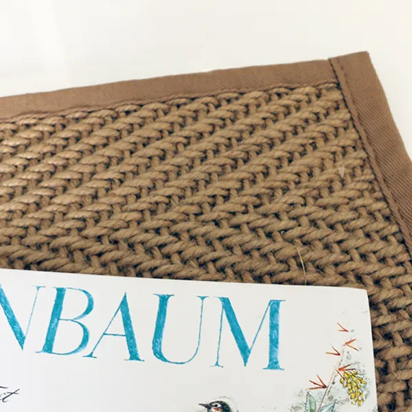 Grenada Natural jute rug with cloth border and lapped corners