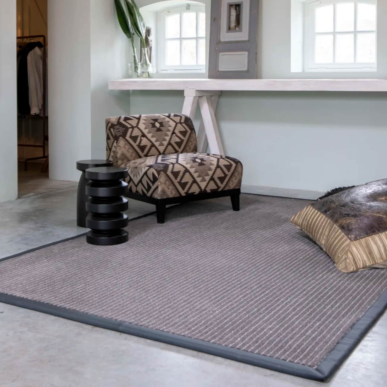 Chalk Route wool rug with leather border in sitting room