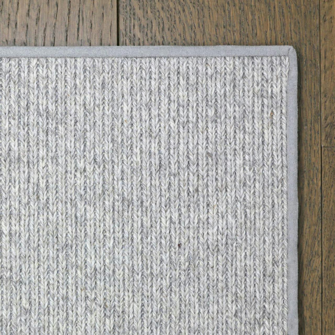 The Sweater Seashell wool rug with blind soft border