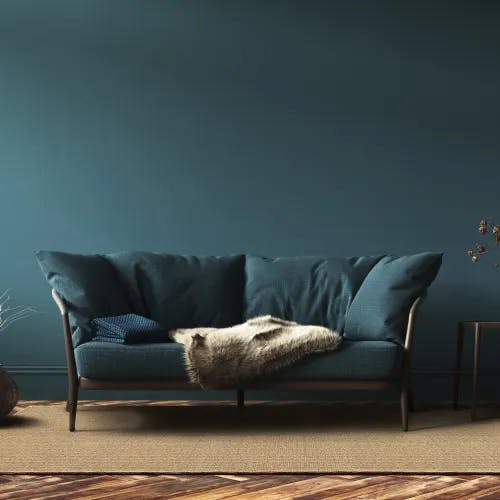 Winthrop Honey SynSisal® area rug in teal-inspired living room