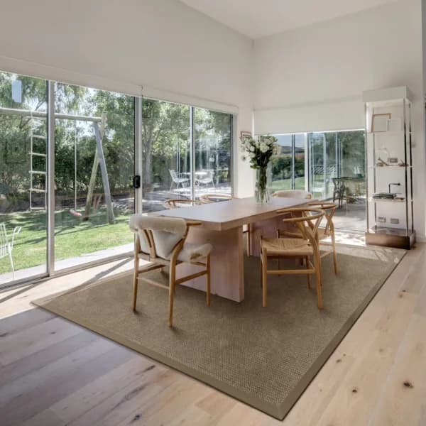 Cottage Bark area rug with cloth border in Scandinavian style dining room